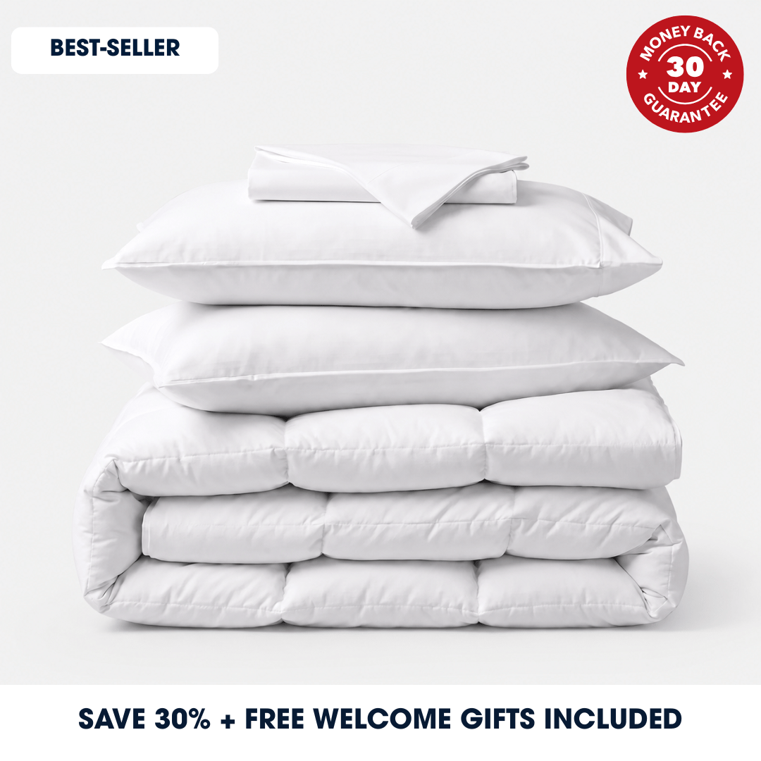 A stack of four white quilted bedding items, including two pillows and two folded comforters, on a light gray background. Promotional text overlays read 'BEST-SELLER' and 'SAVE 30% + FREE WELCOME GIFTS INCLUDED', with a red badge stating 'MONEY BACK 30 DAY GUARANTEE'.