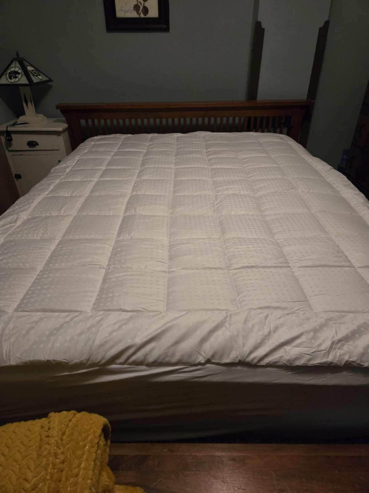 Foto de un cliente de su cama hecha